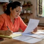 Woman reviewing immigration documents and translations