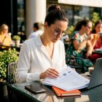 Woman reviewing certified ISO translation documents