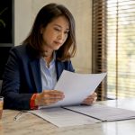 Woman reviewing credential translation documents