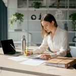 Legal translator reviewing documents in court office