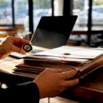 NAATI certification badge near translated contracts