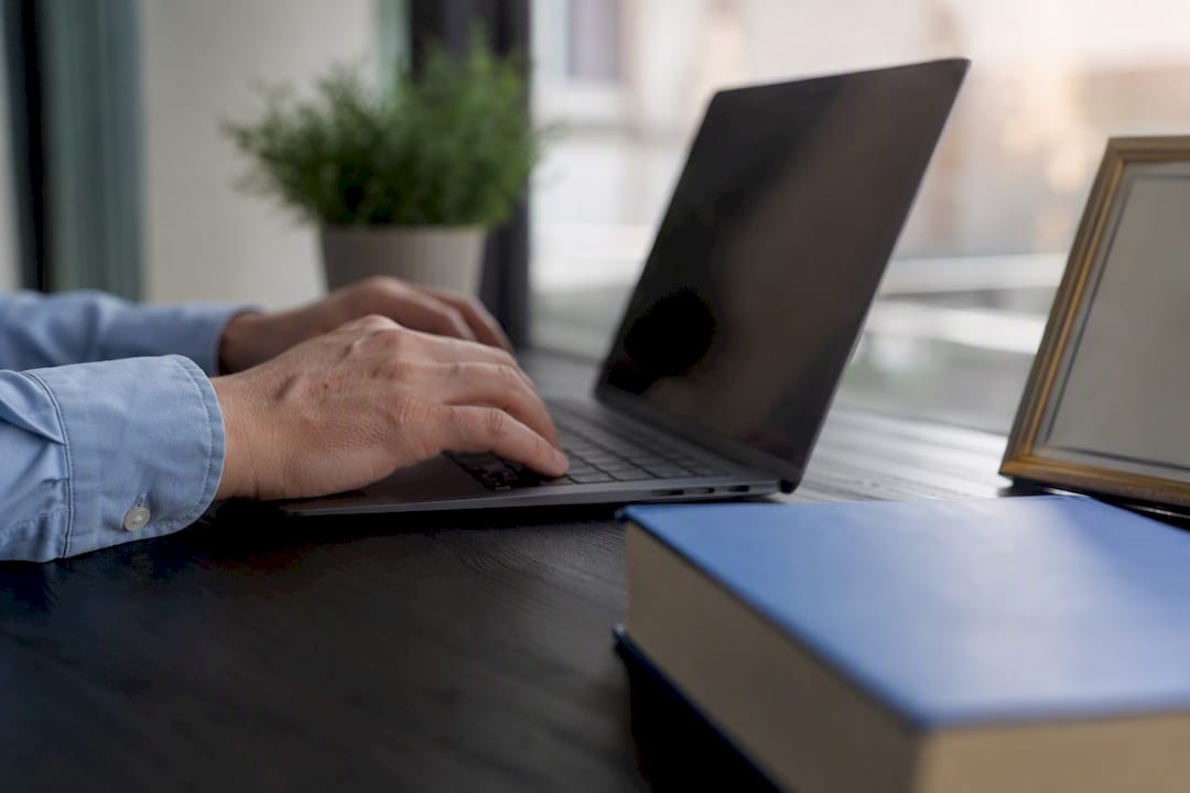 Translator hands typing with translation tools